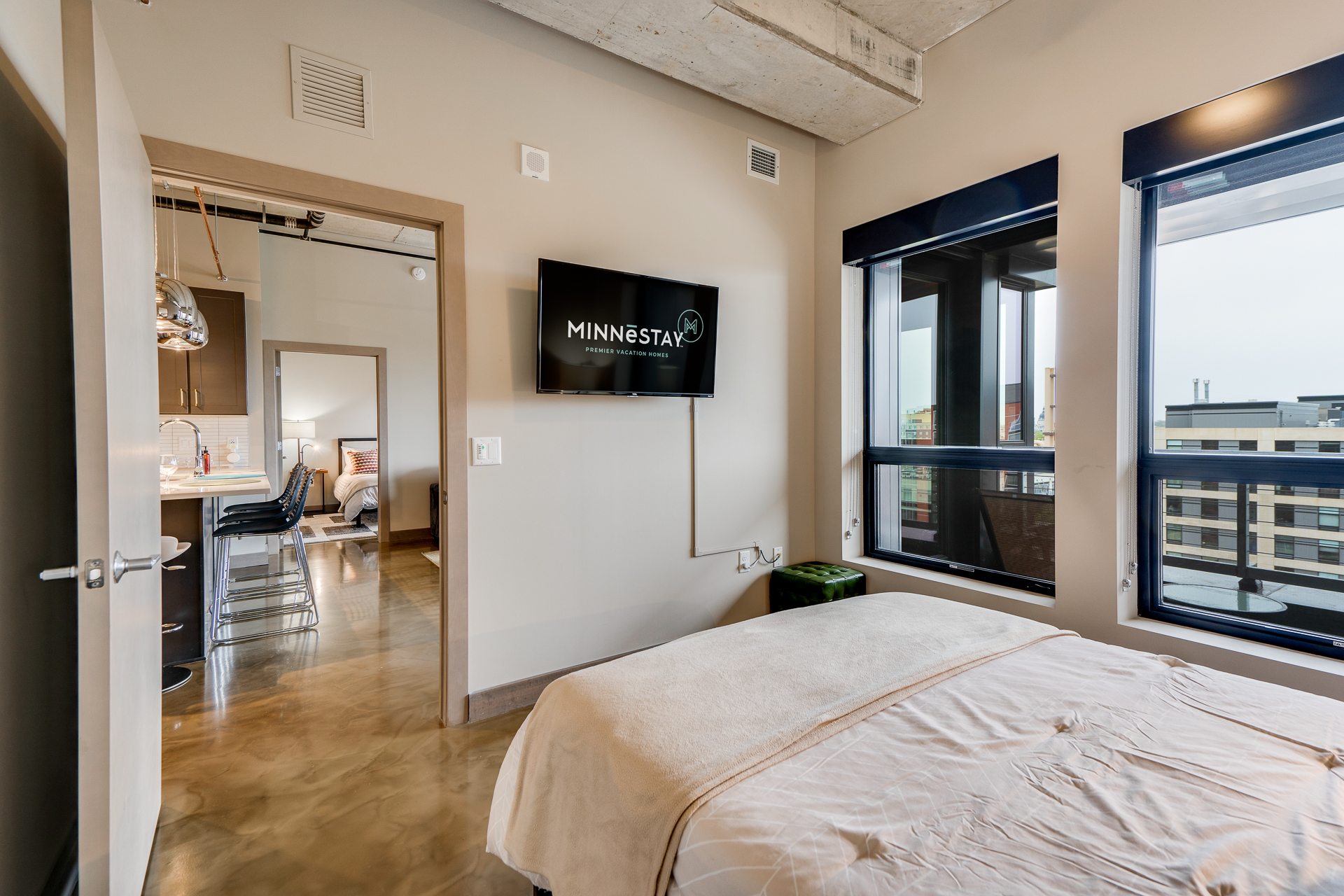 A modern urban apartment bedroom featuring a sleek design and a cozy ambiance.