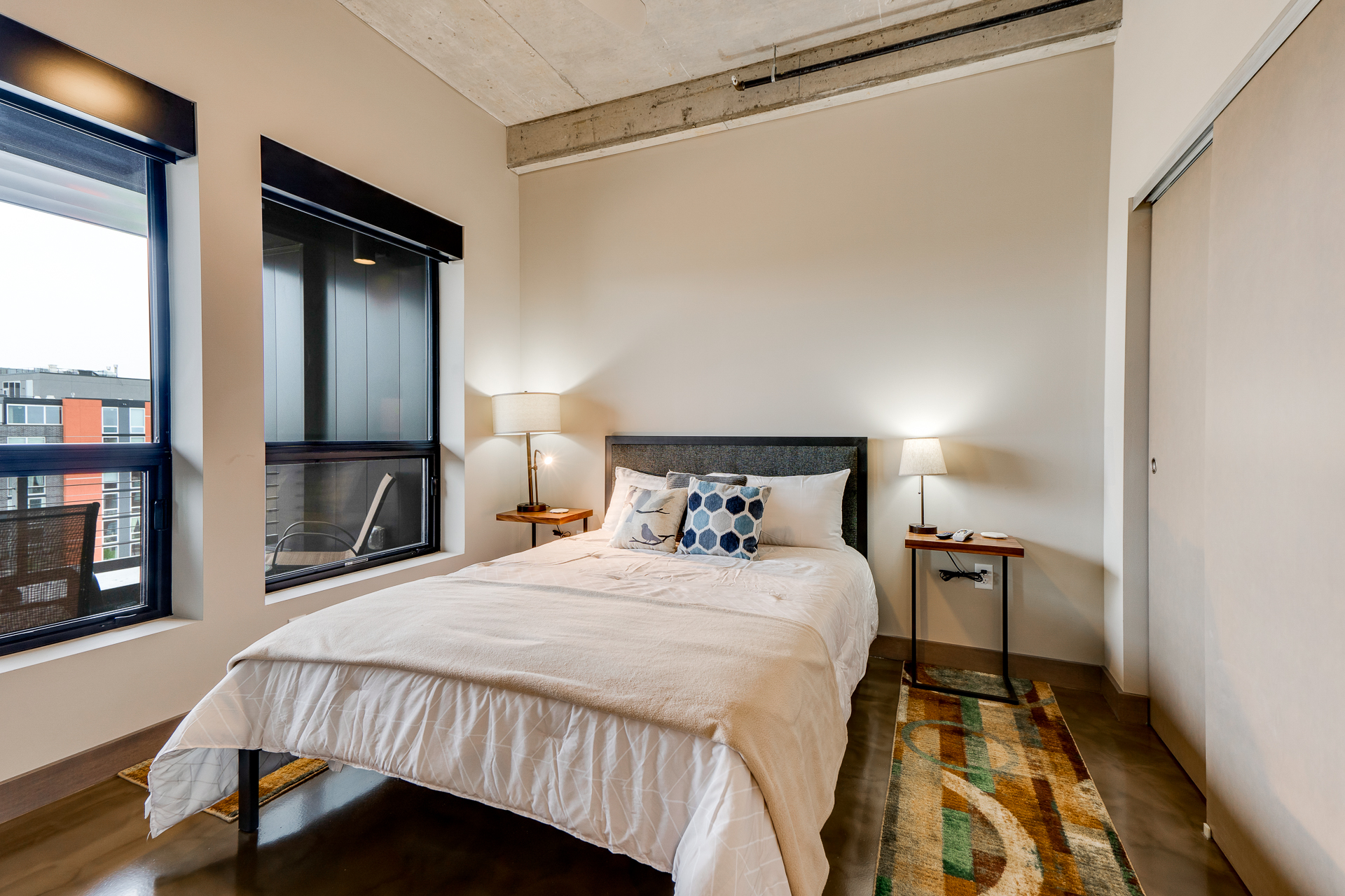 A modern bedroom featuring a cozy bed and stylish decor.