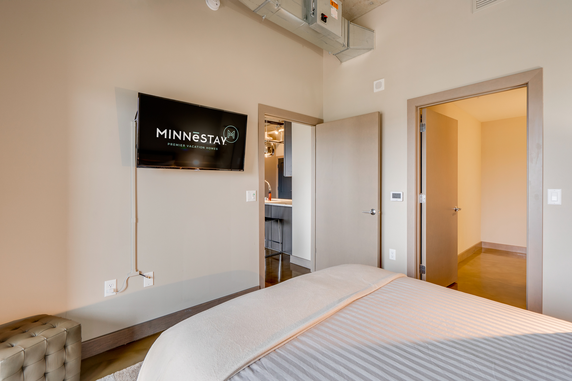 Modern bedroom interior featuring a TV and stylish decor.
