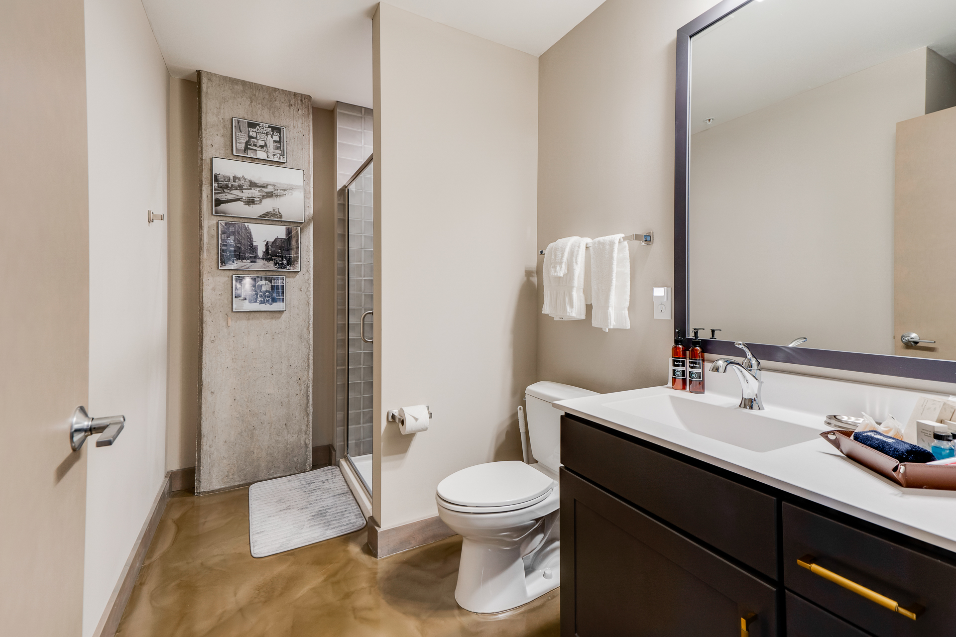 Modern bathroom with minimalist design and artistic touches.