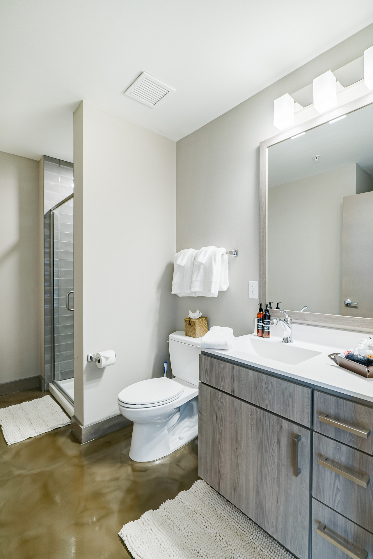 A modern and minimalist bathroom design with clean lines and neutral tones.