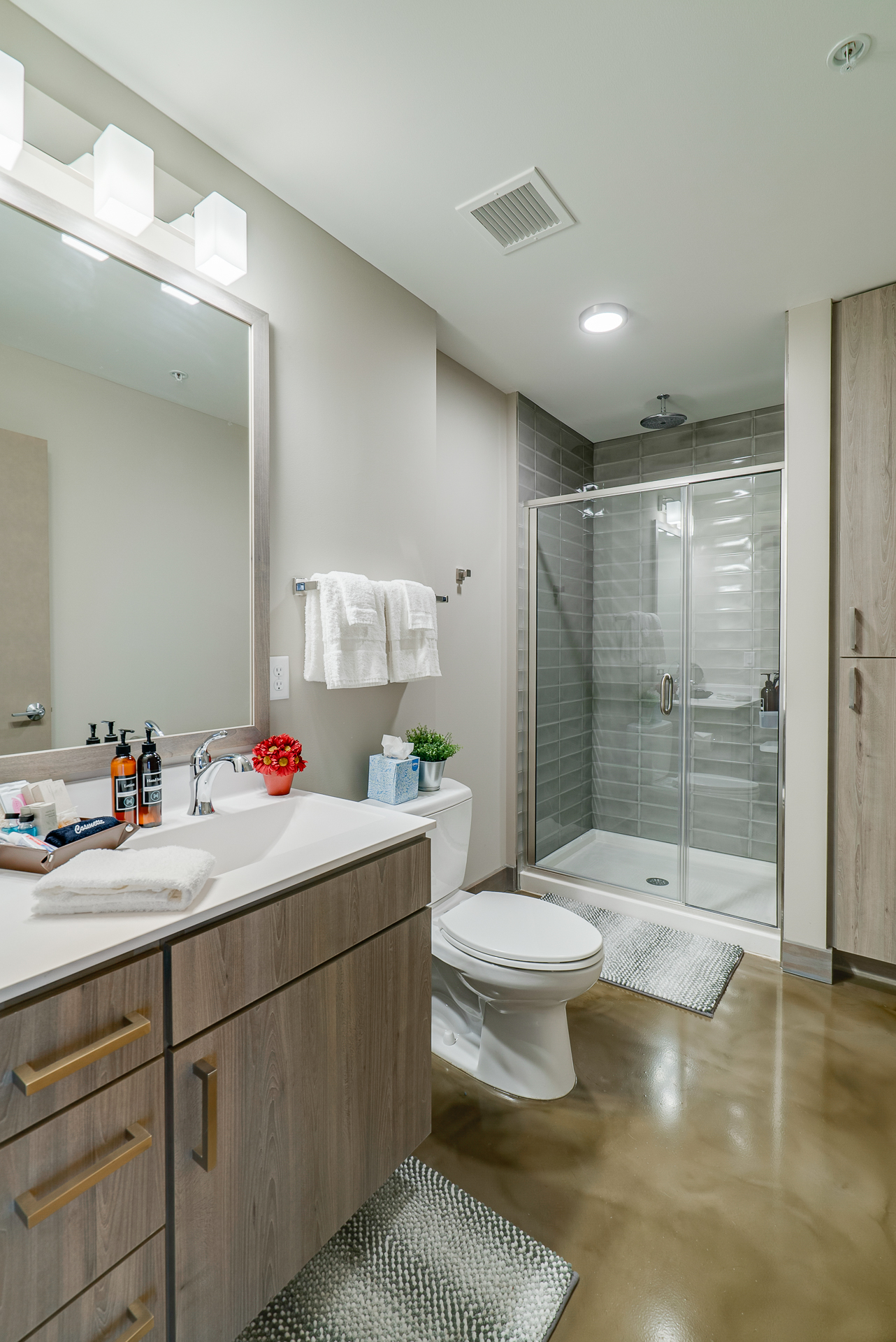 A stylish modern bathroom with minimalist design and soothing color palette.