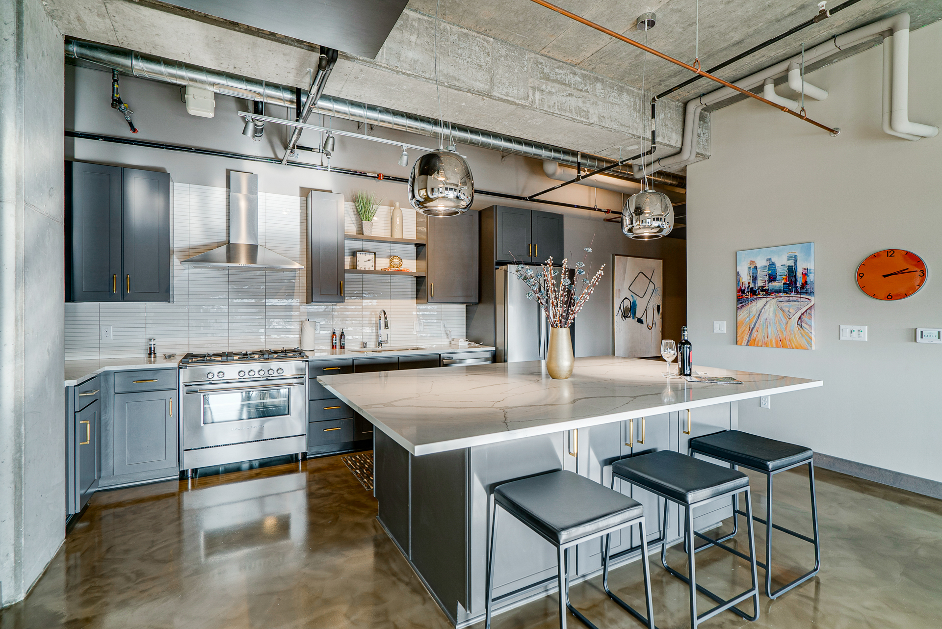 A sleek, modern kitchen with elegant finishes and industrial elements.