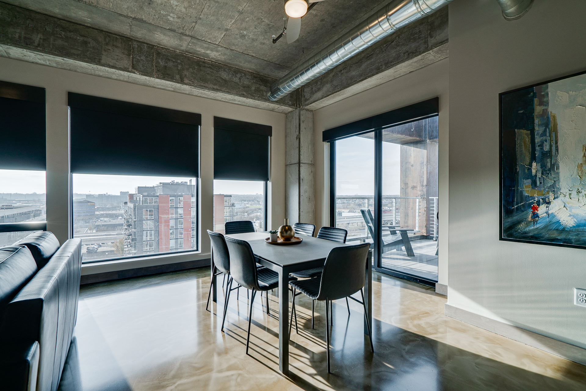 Chic dining area with urban views and modern decor.