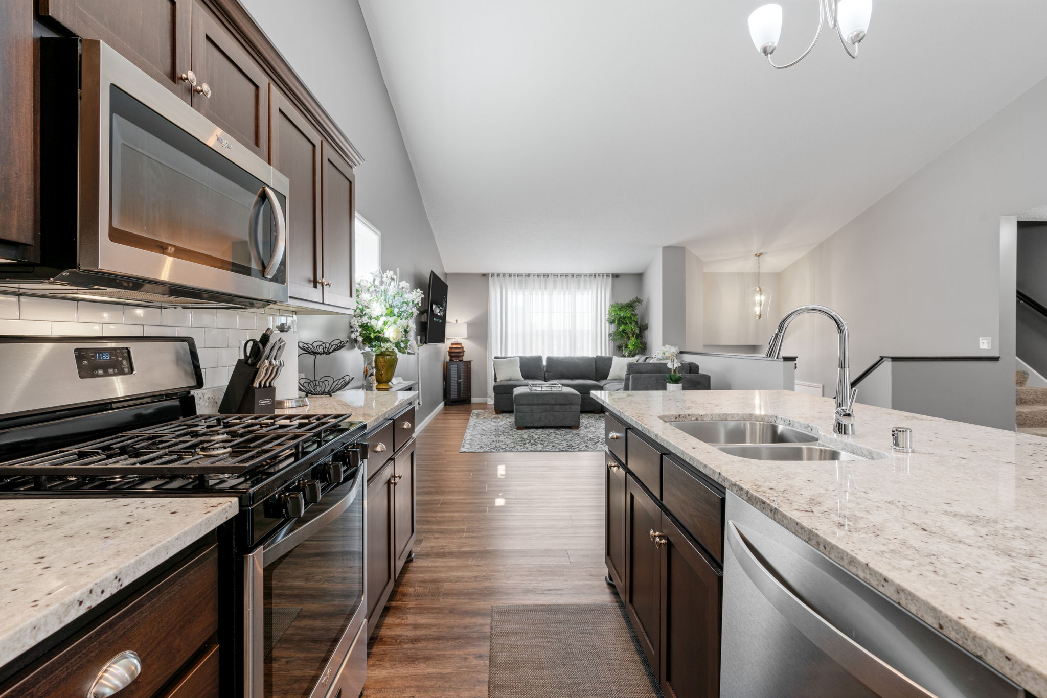Modern open-concept kitchen and living area with stylish features.