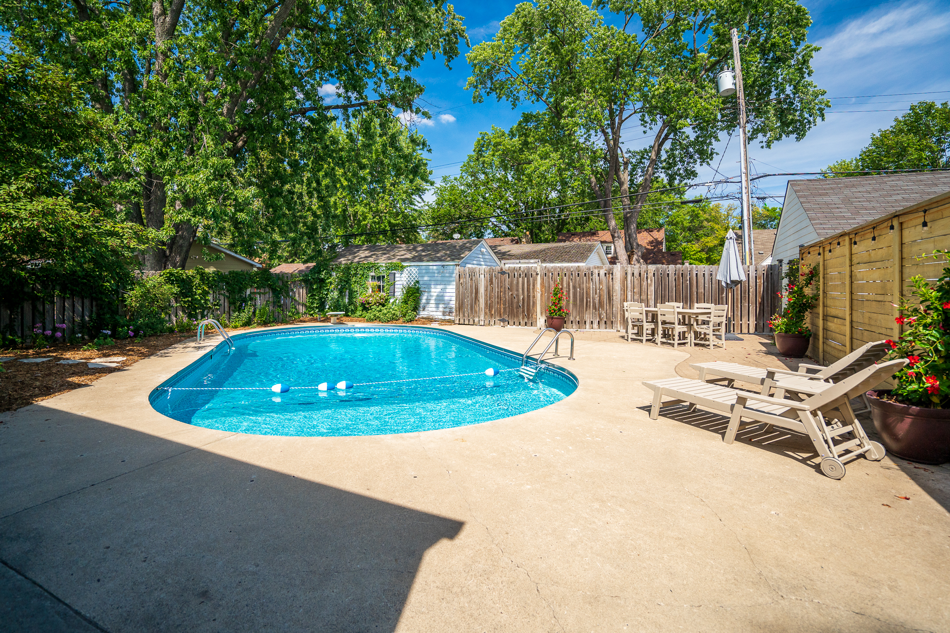 Bright and inviting backyard pool area on a sunny day.