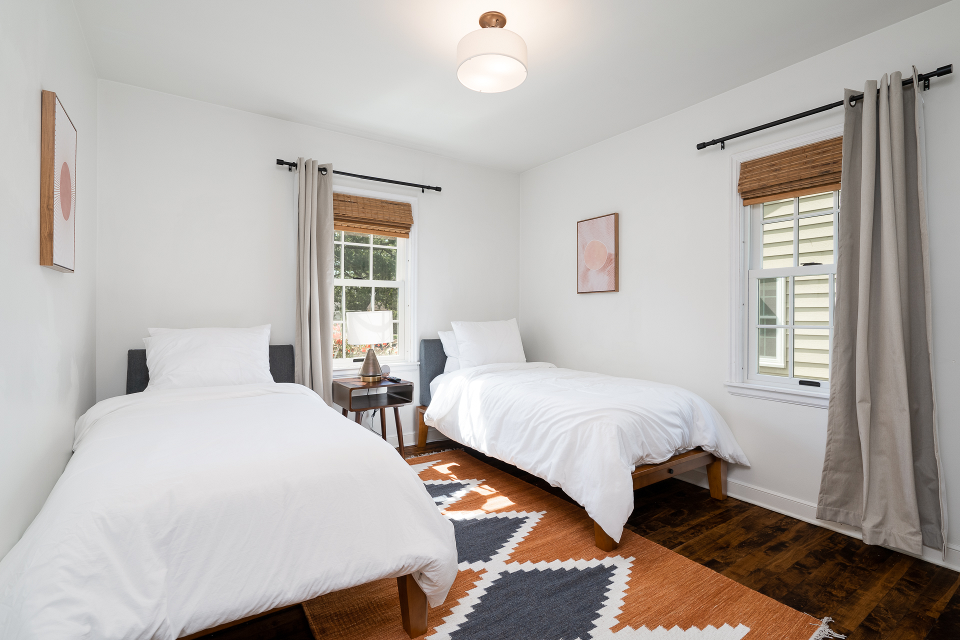 Bright and minimalistic twin bedroom with modern touches.