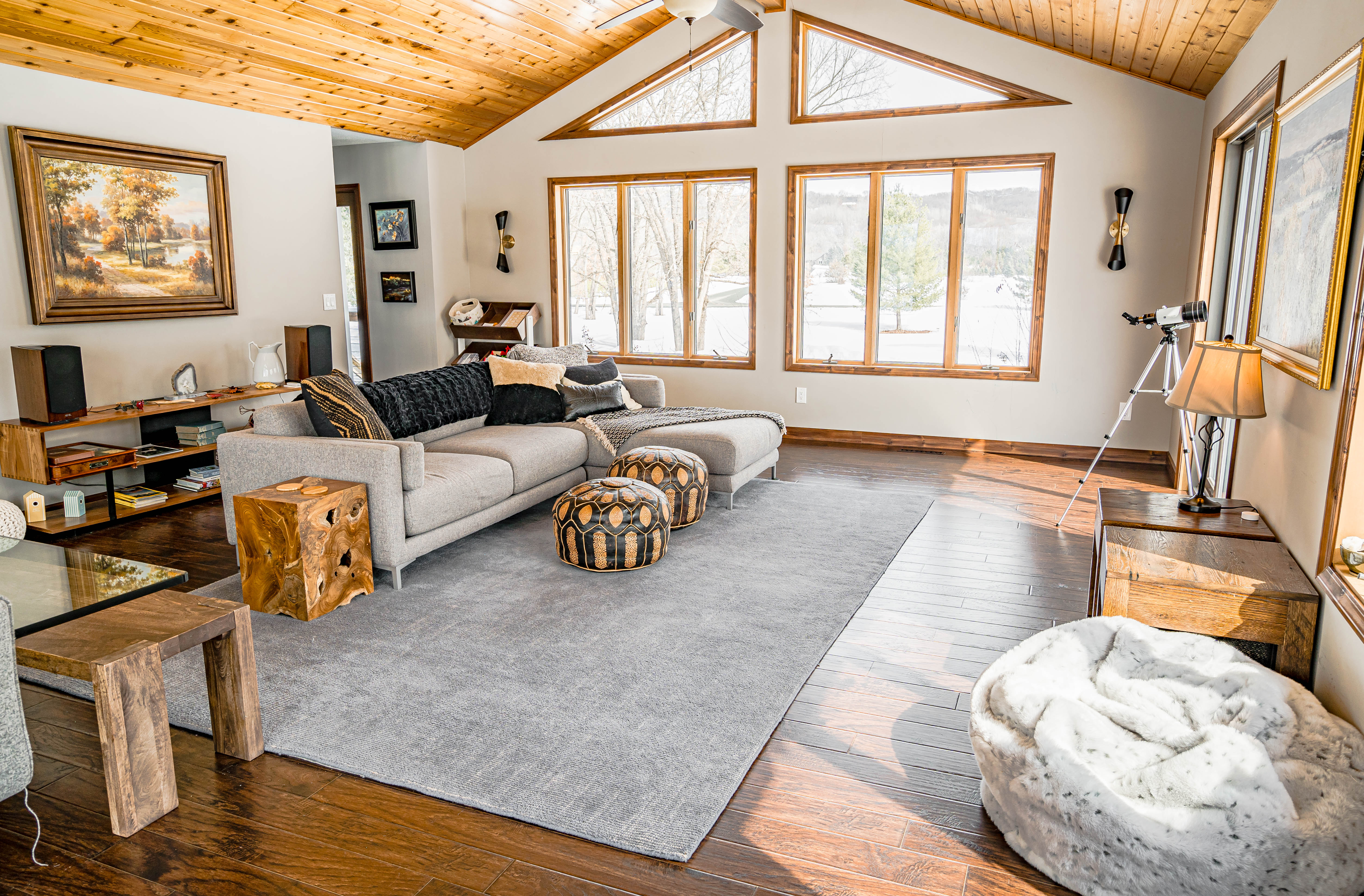 A welcoming modern living room filled with natural light and rustic charm.