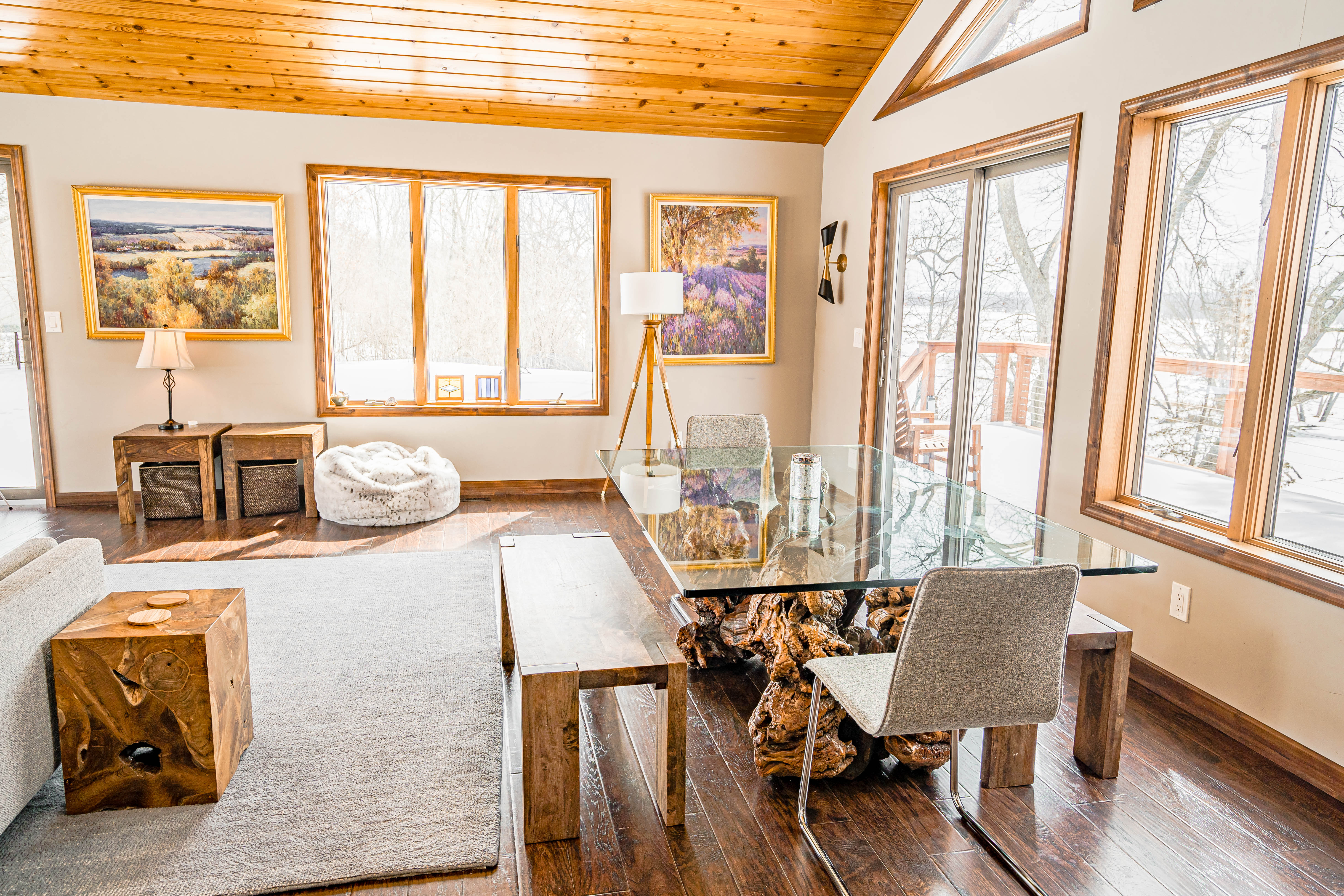 Cozy living space filled with natural light and rustic décor.