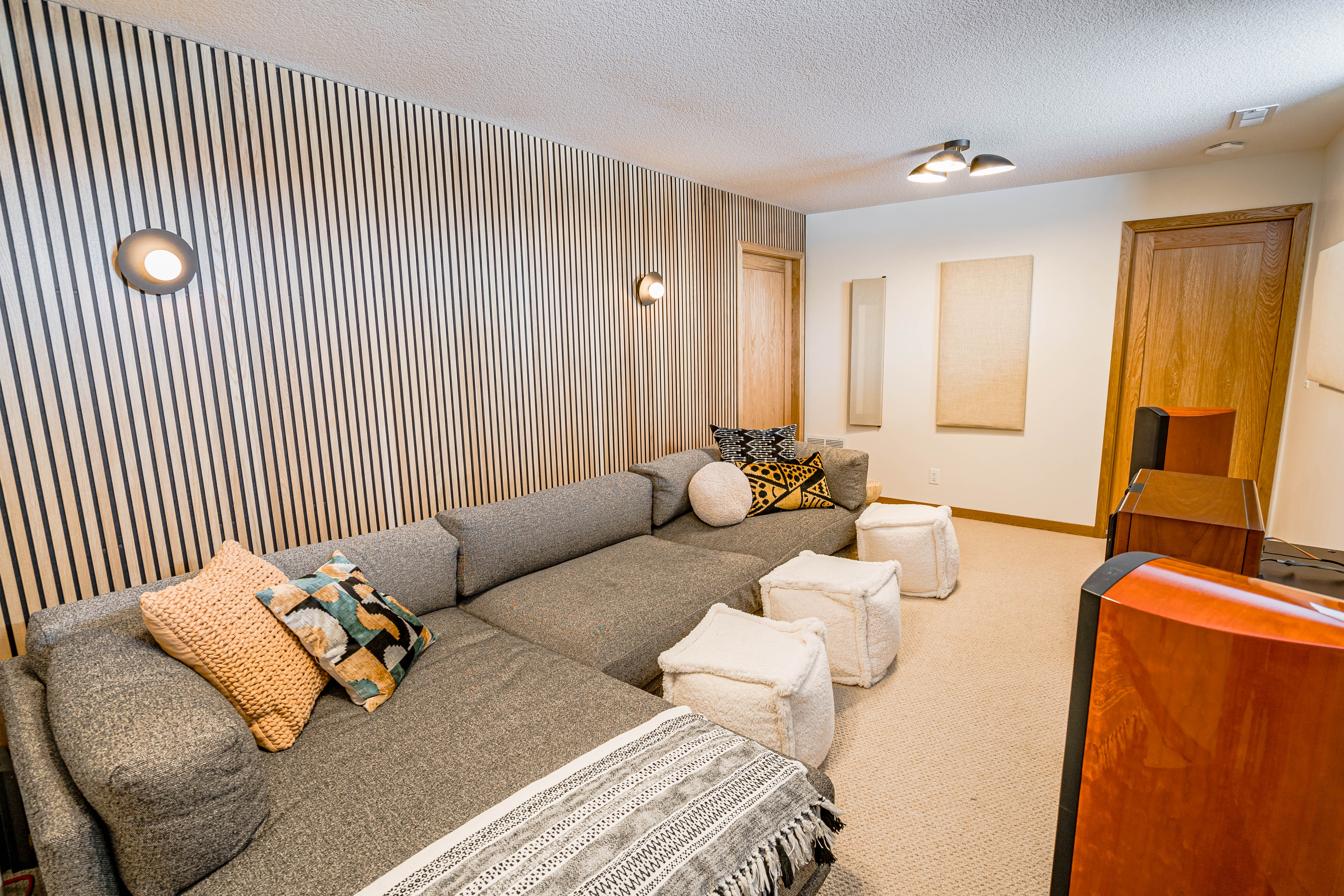 A cozy and modern living room featuring a plush sectional sofa and stylish decor.