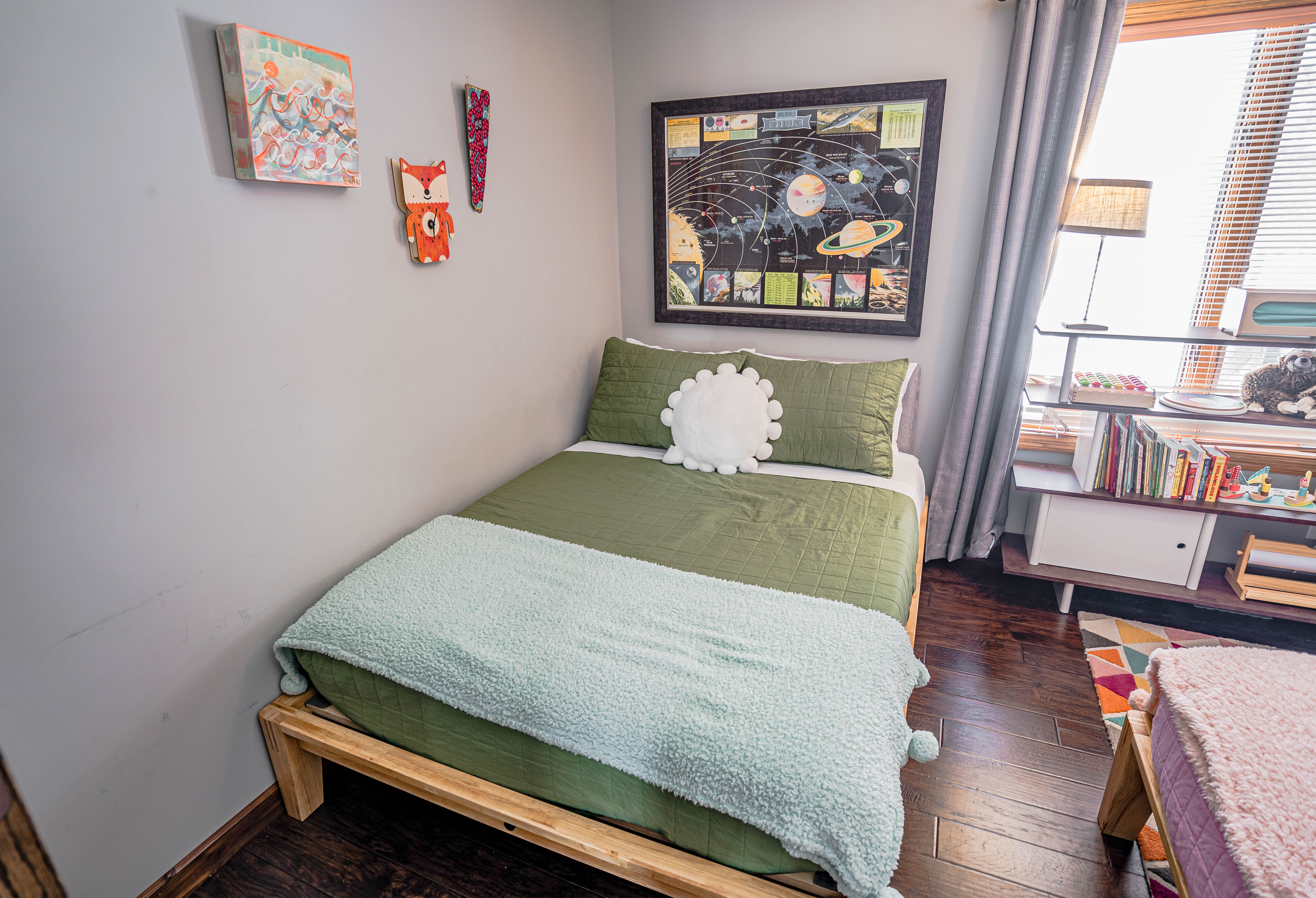 A charming children's bedroom with playful decor and educational themes.