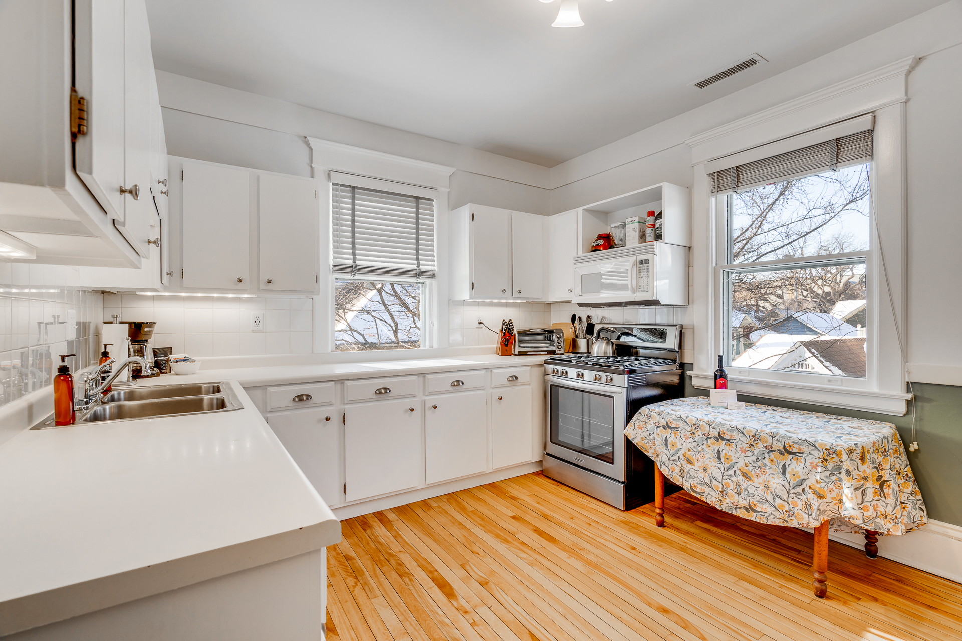A bright and welcoming kitchen with modern appliances and cozy decor.