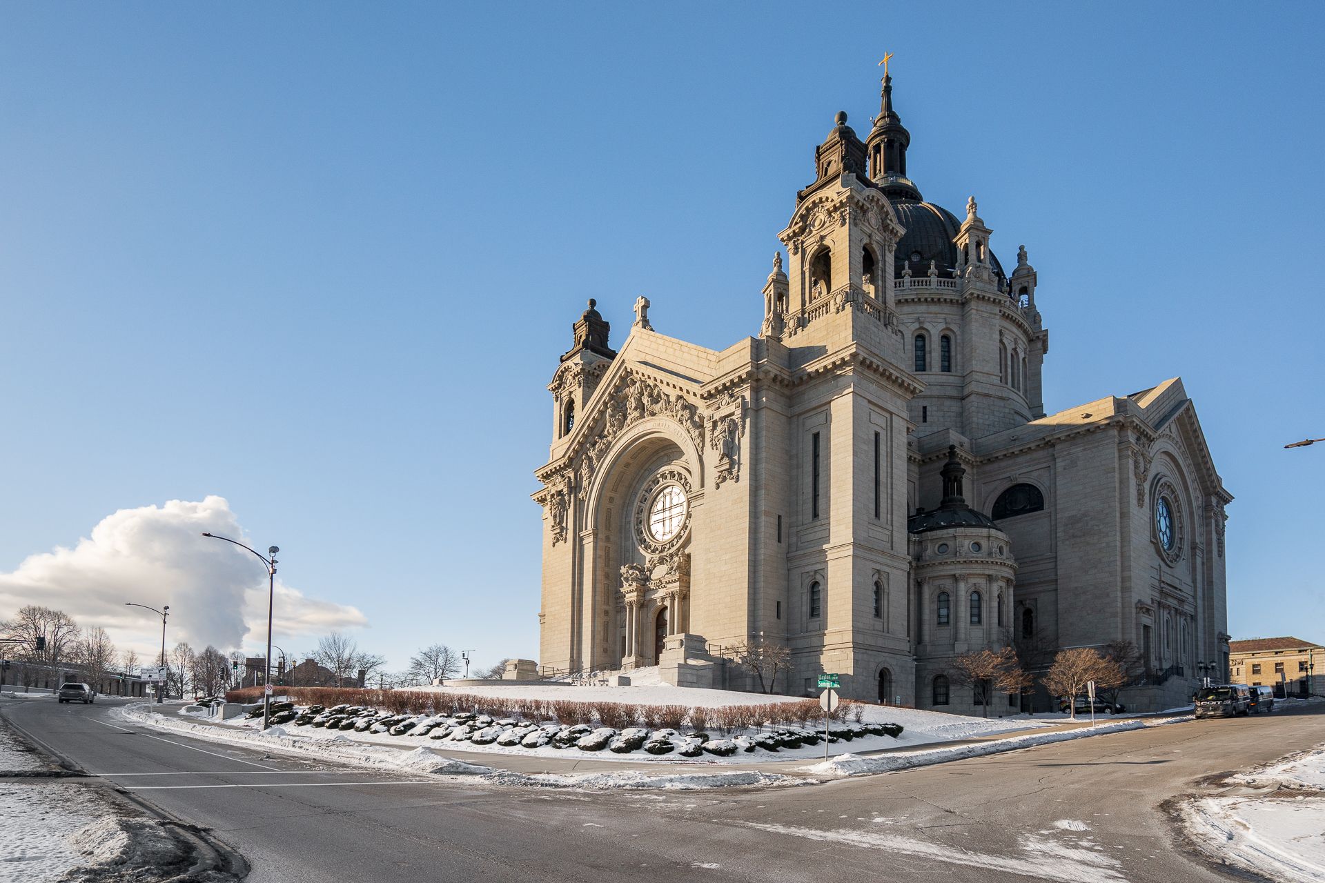 A majestic cathedral basking in winter sunlight under a clear blue sky.