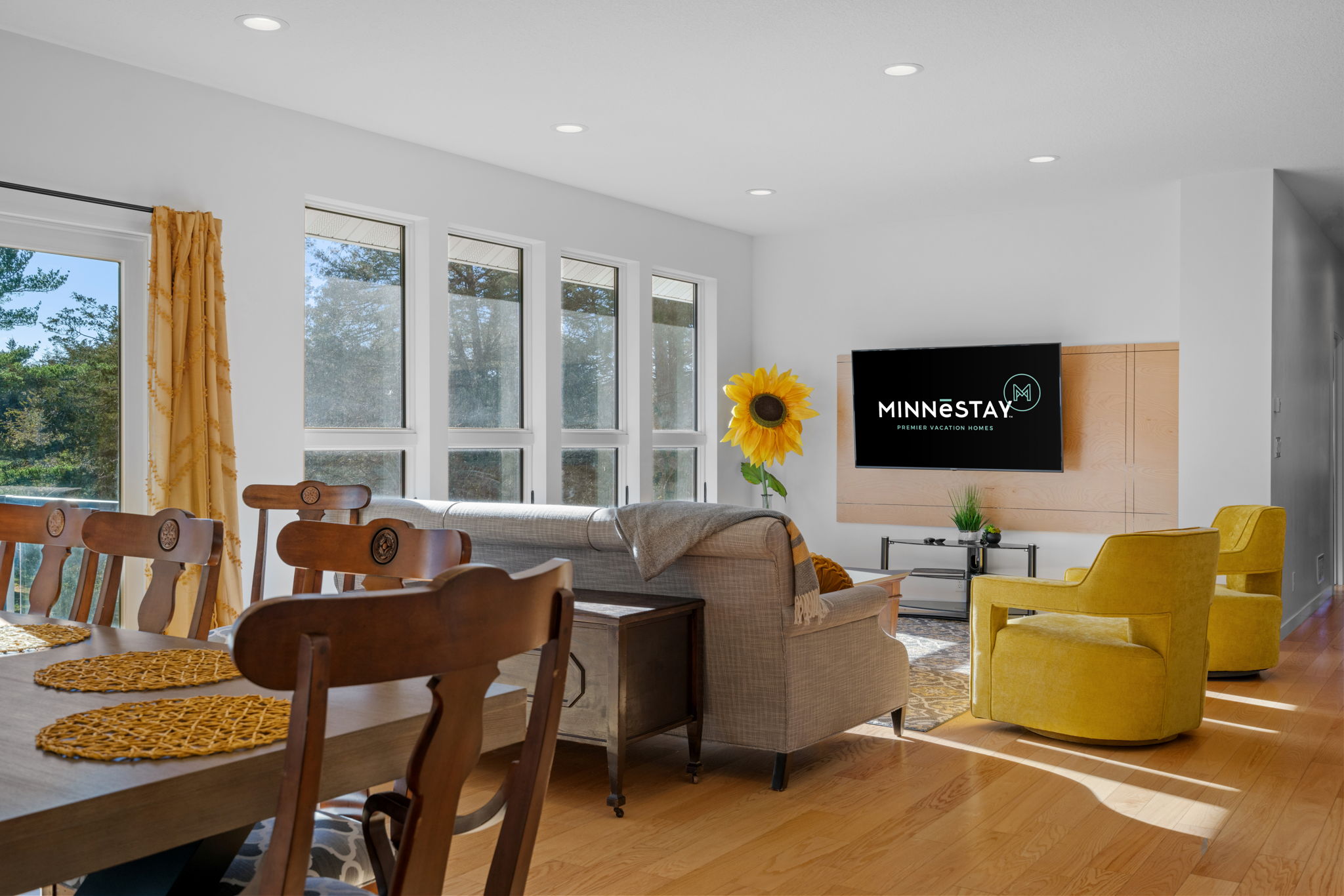 A bright and cozy living space with a cheerful sunflower accent.
