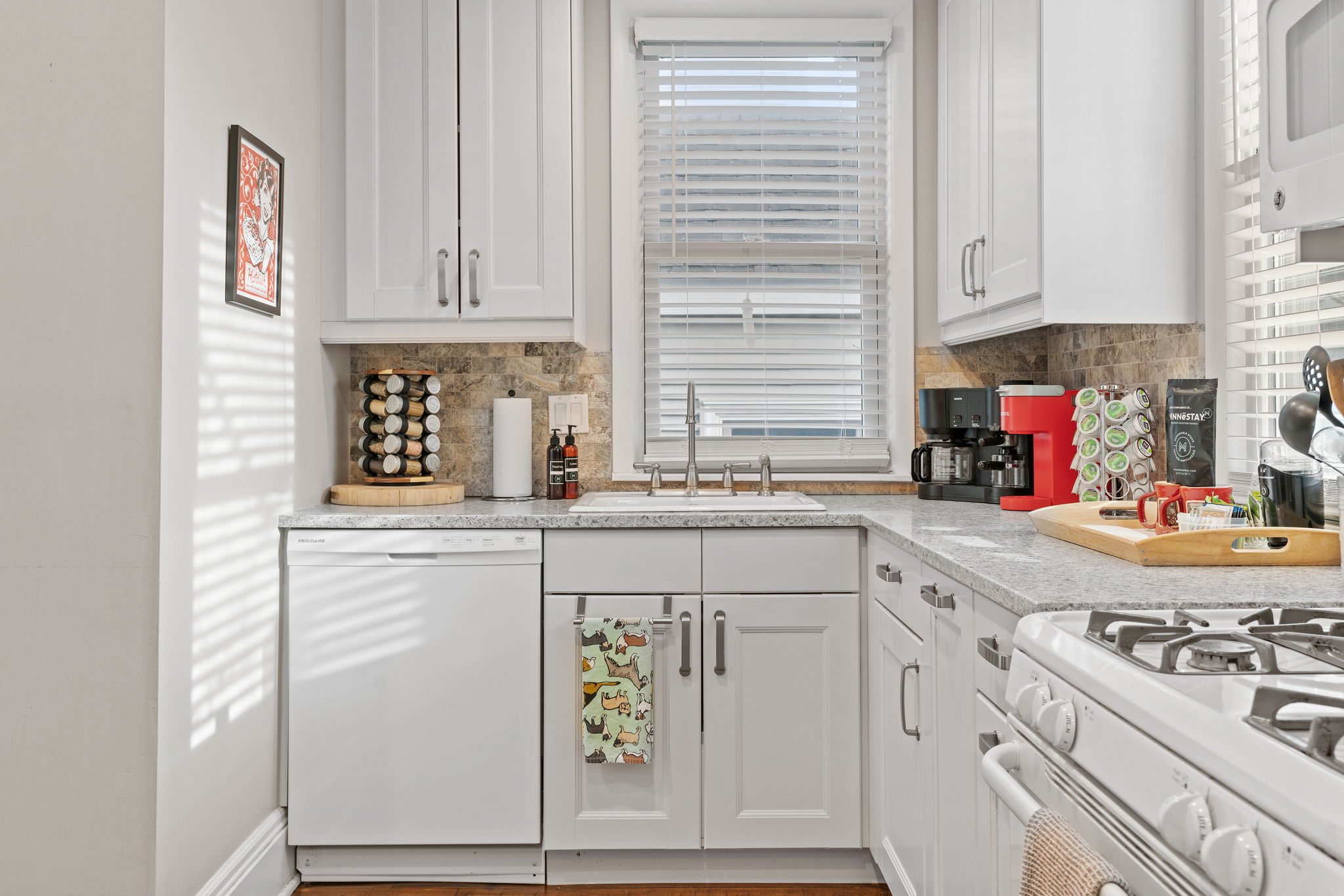 A bright and modern kitchen with essential appliances and stylish decor.