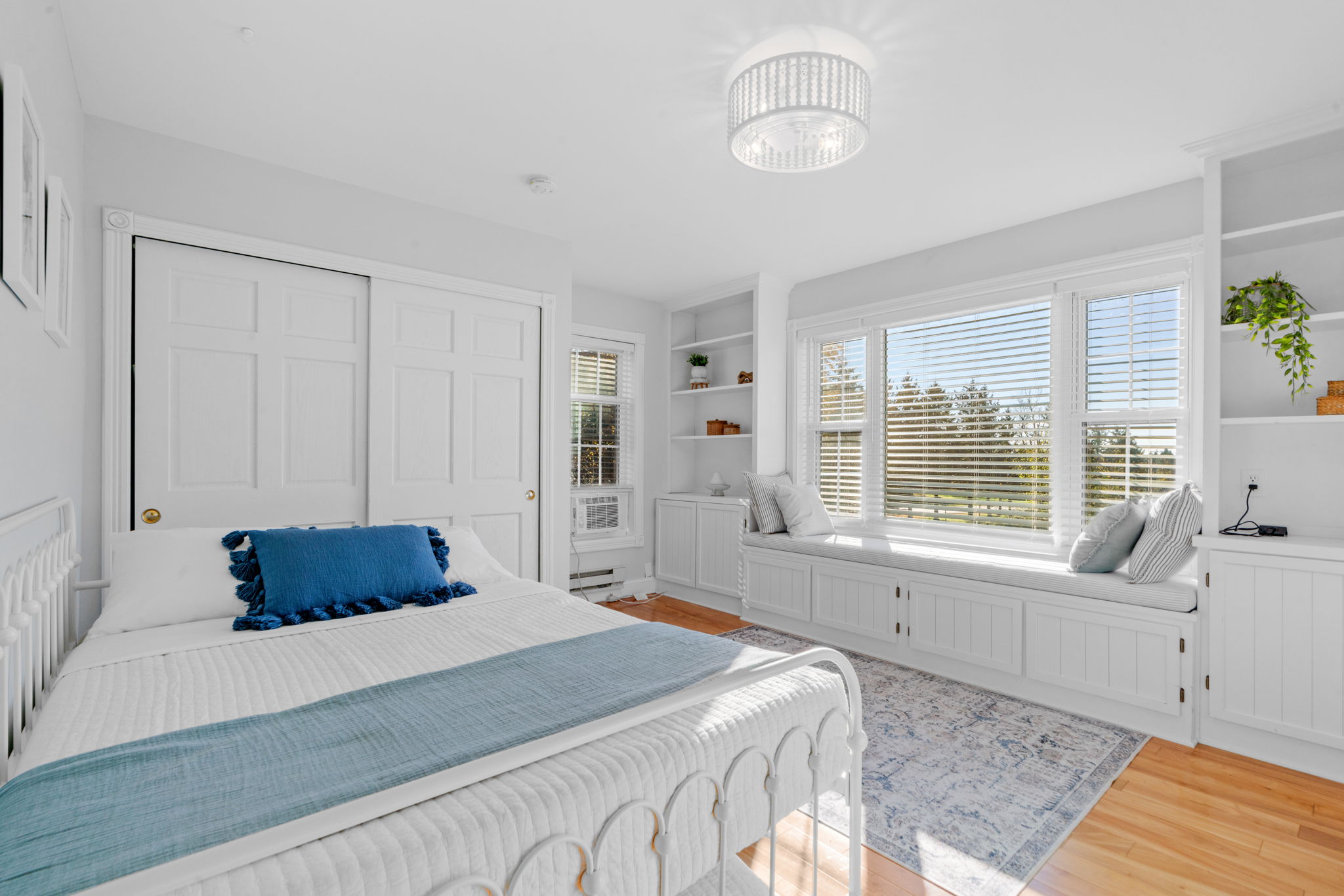 A bright and airy bedroom with modern decor and a cozy atmosphere.