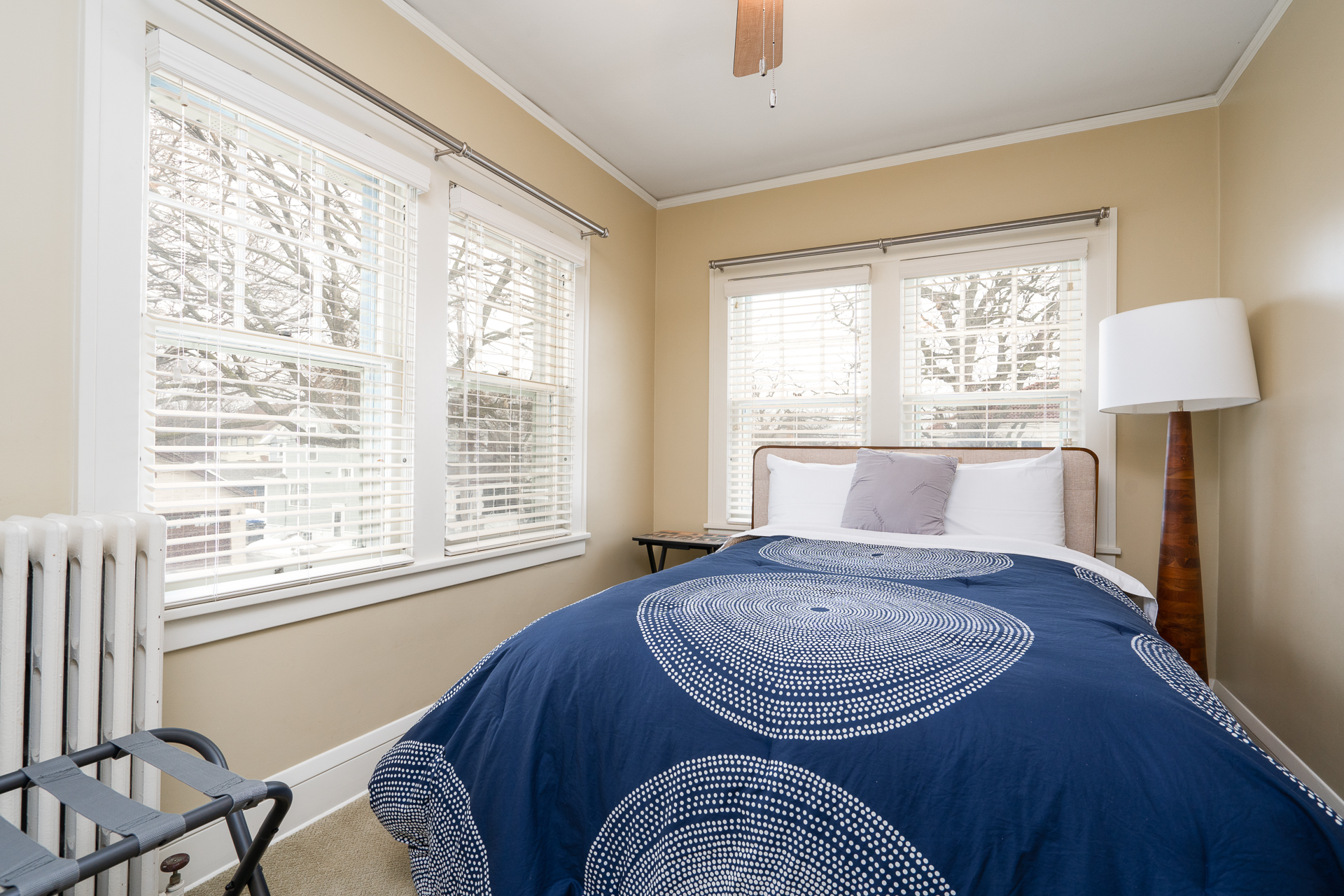 A serene and inviting bedroom with natural light and modern decor.