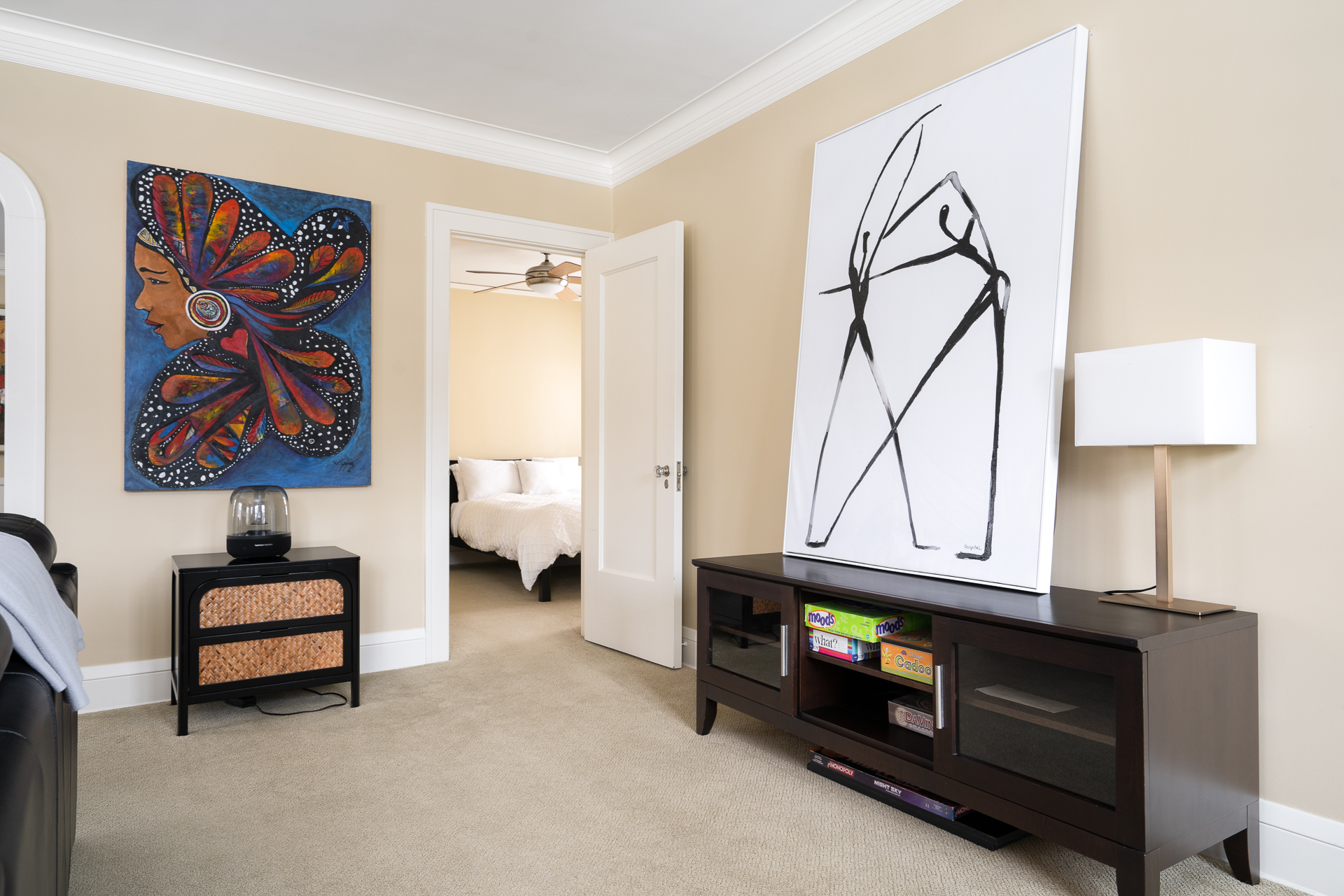 A vibrant living area featuring colorful artwork and modern furnishings.