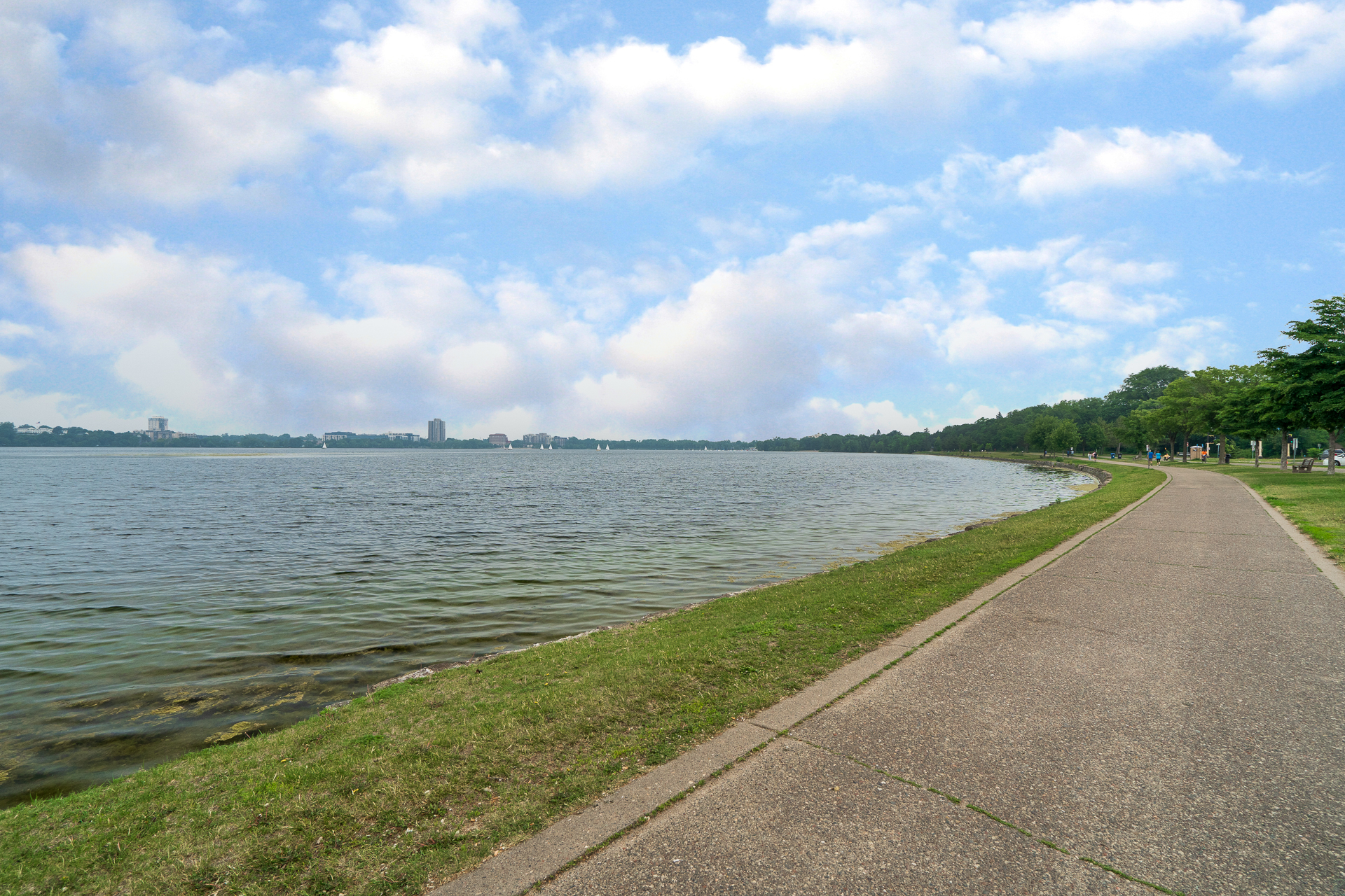 A serene lakeside path inviting peaceful walks and reflection.