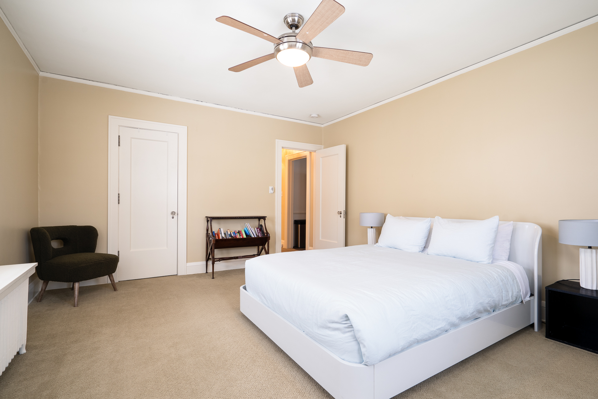 A tranquil and modern bedroom with light blue accents and cozy furnishings.