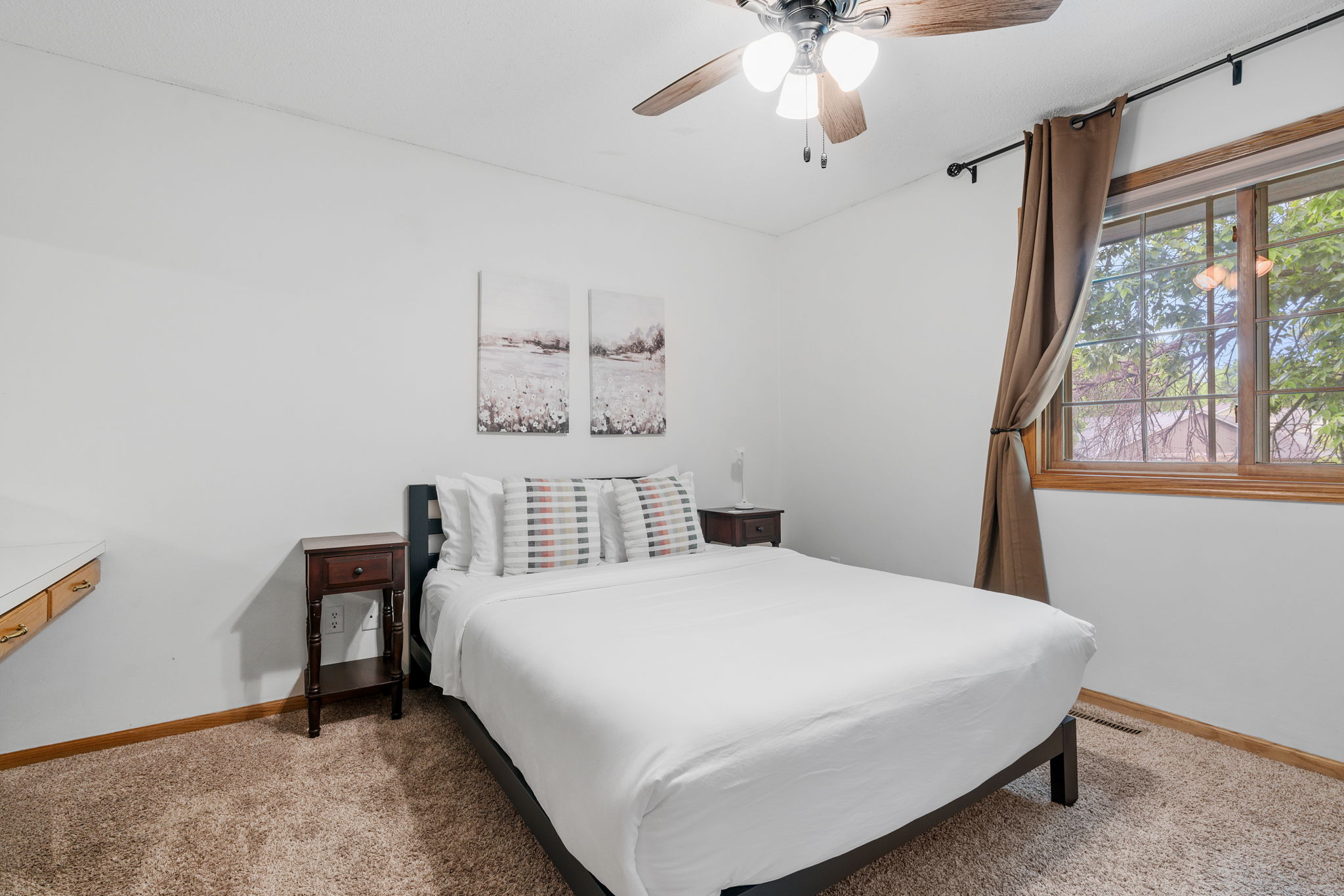 A cozy and inviting bedroom with warm tones and natural light.