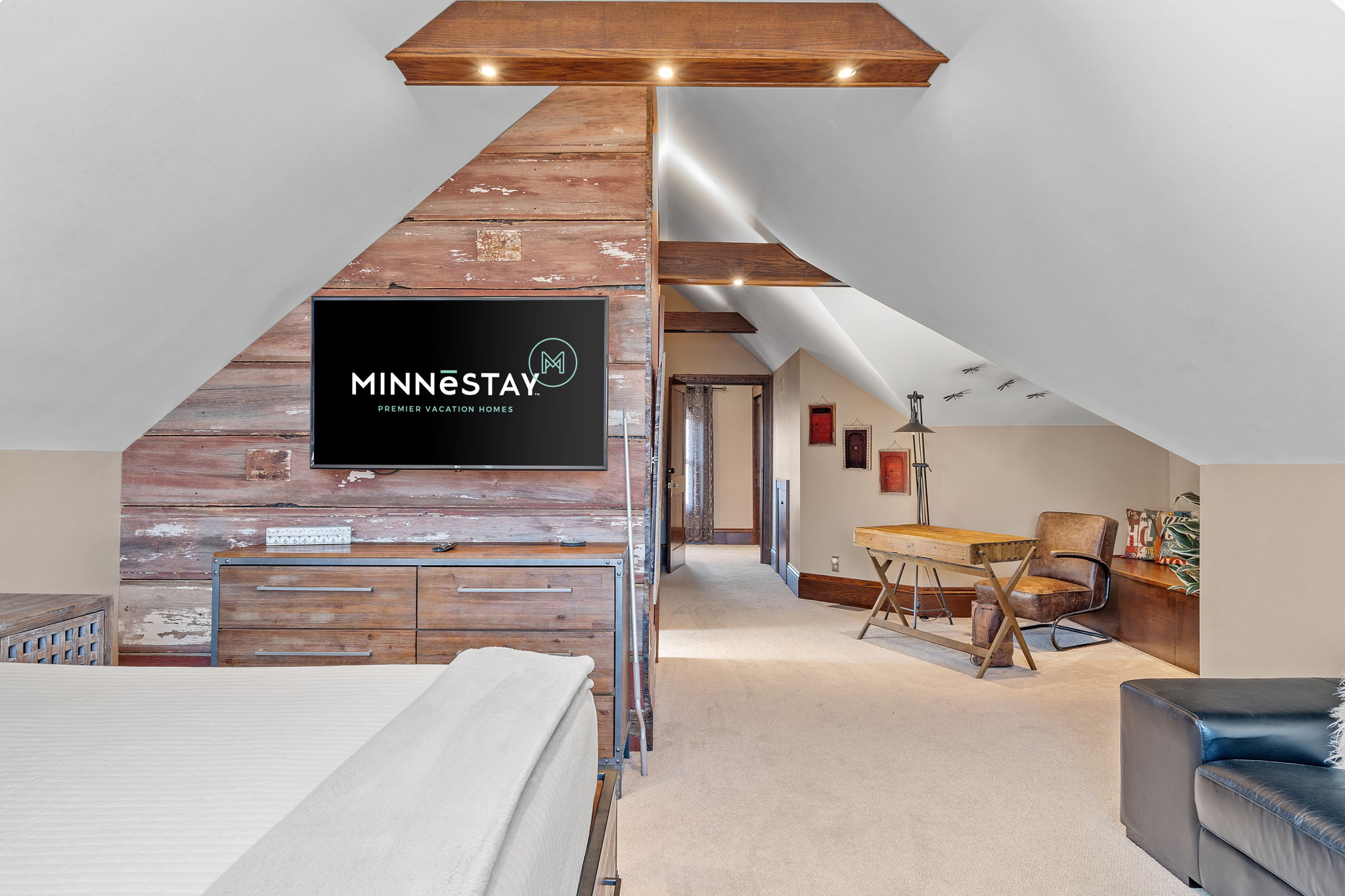 Stylish attic bedroom with rustic decor and cozy atmosphere.