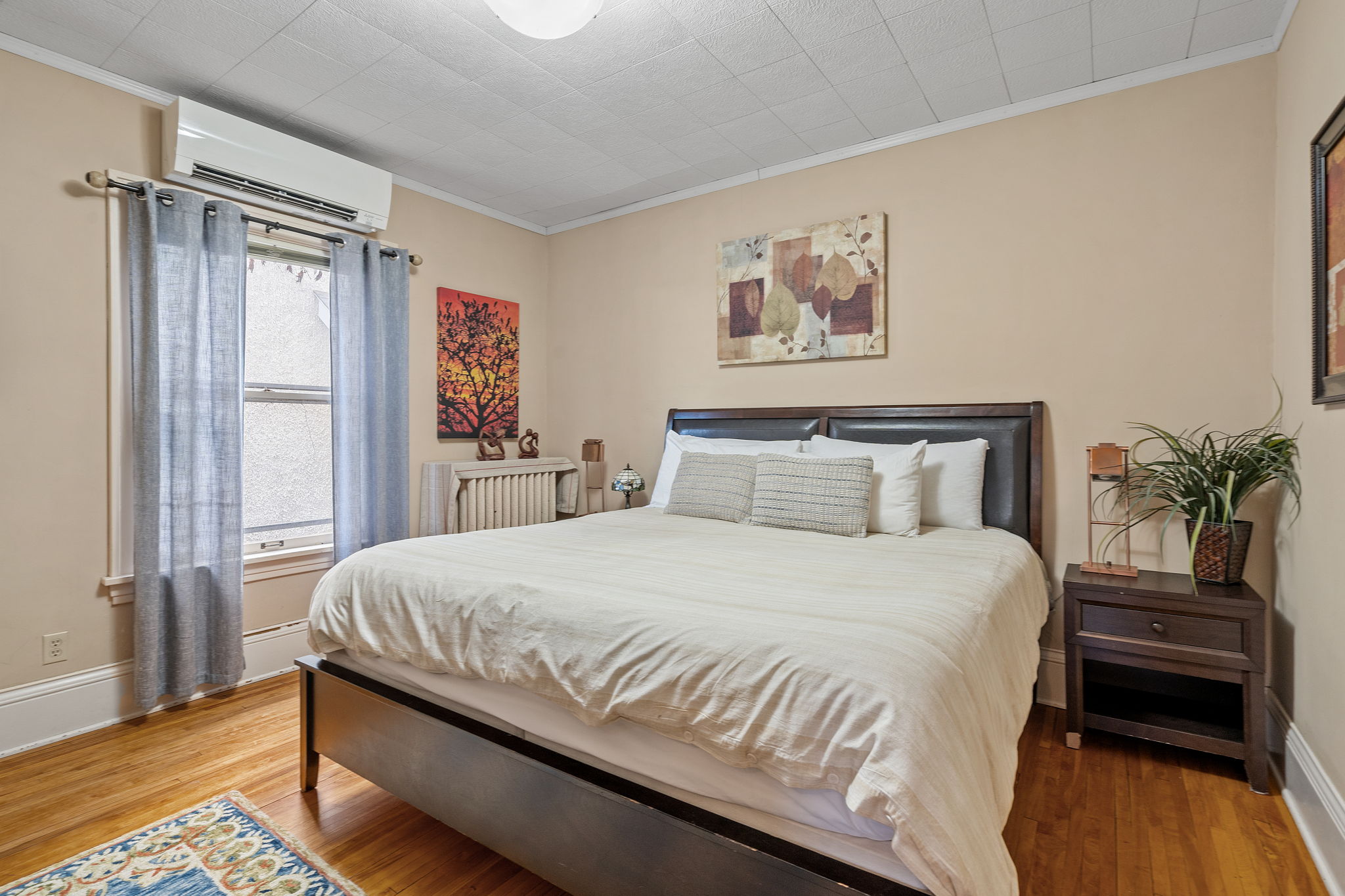 A warmly decorated bedroom with a cozy atmosphere and inviting decor.