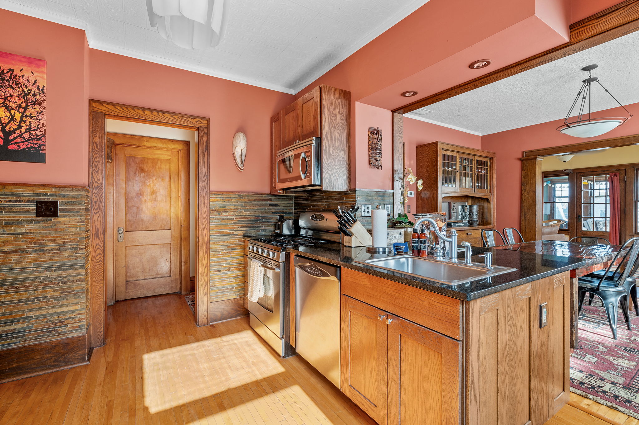 A modern kitchen with warm colors and rustic accents.