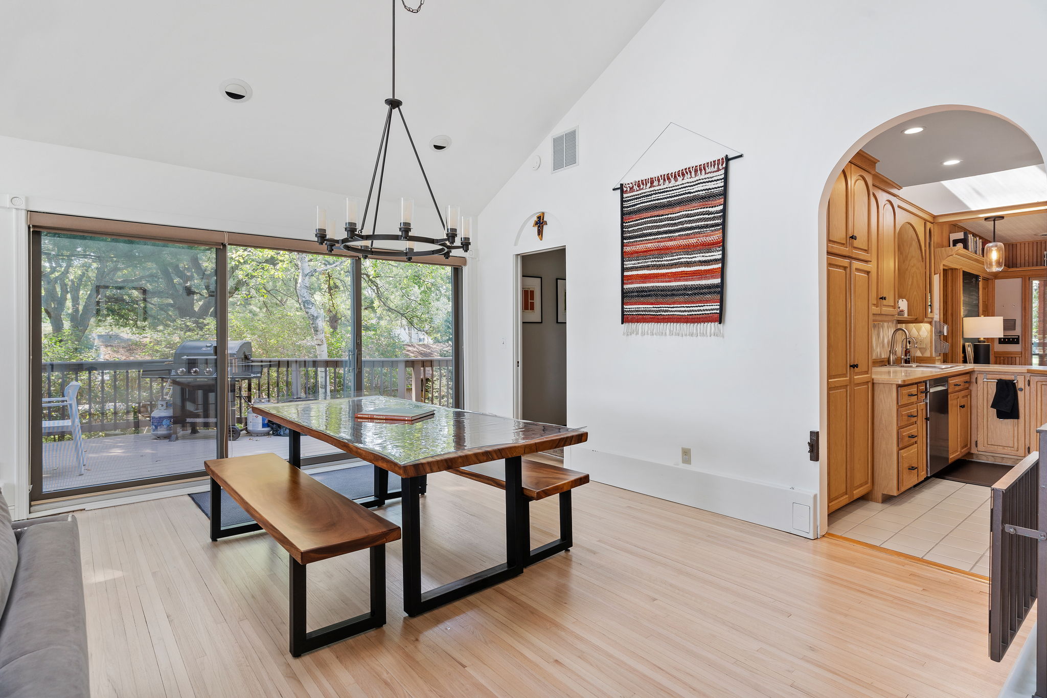 Cozy dining area with a rustic table and access to an inviting outdoor space.