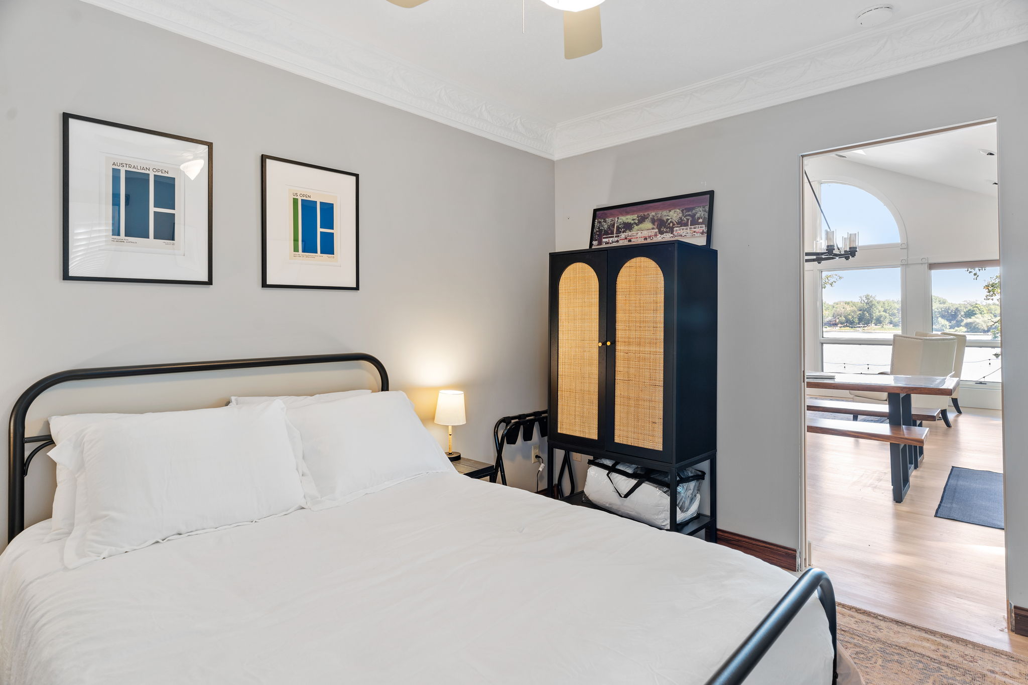 Stylish and cozy bedroom with artistic prints and a harmonious layout.