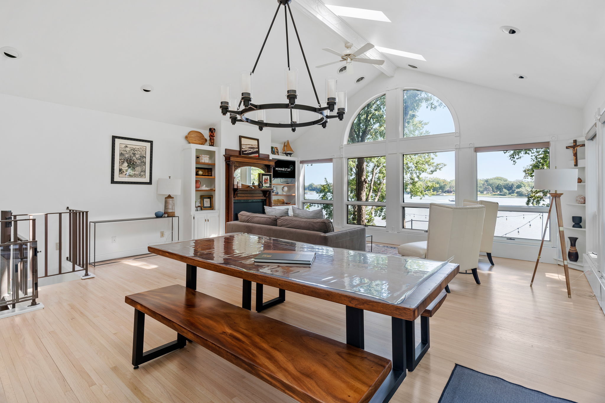 A bright and inviting living space with beautiful lake views and stylish decor.