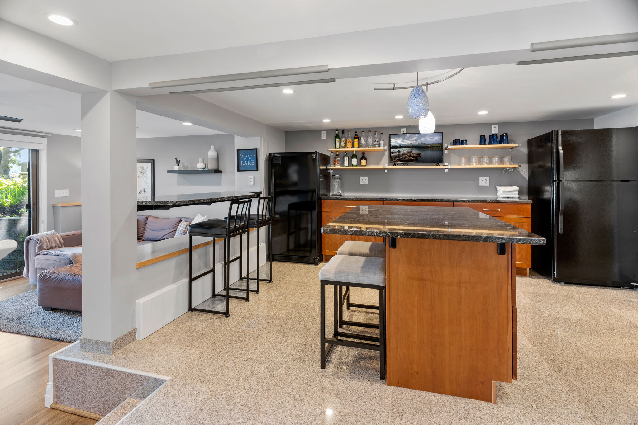 A modern kitchen designed for comfort and style, featuring an inviting island and seamless flow to the living area.
