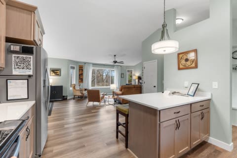 Modern open concept kitchen and living area with natural light.