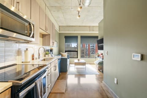 Interior view of a contemporary apartment with kitchen and living space.