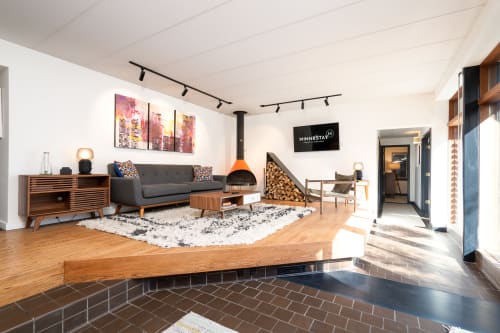 A stylish modern living room with vibrant accents and a cozy atmosphere.