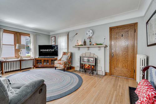 A cozy living room featuring warm tones and comfortable furniture.