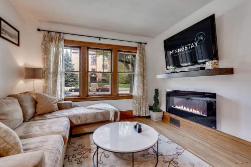 Cozy living room with modern decor and a warm ambiance.