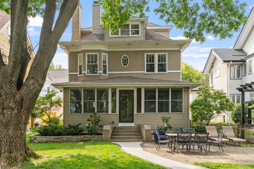 A beautiful historic home with elegant architecture and inviting outdoor space.