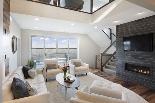 Modern living room with stunning water views and elegant design.