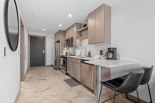 A modern kitchen with sleek cabinetry and contemporary appliances, perfect for urban living.