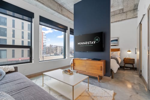 A modern vacation rental living space with stylish furnishings and natural light.