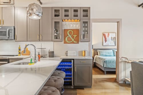 A modern kitchen seamlessly connecting to a cozy bedroom.