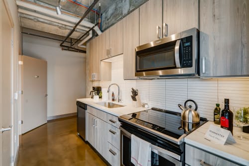 A stylish modern kitchen with sleek appliances and inviting decor.
