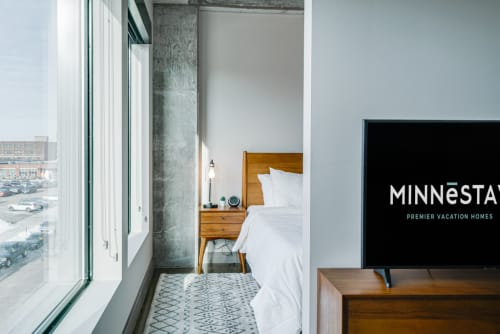 Modern bedroom with a view and minimalist decor.
