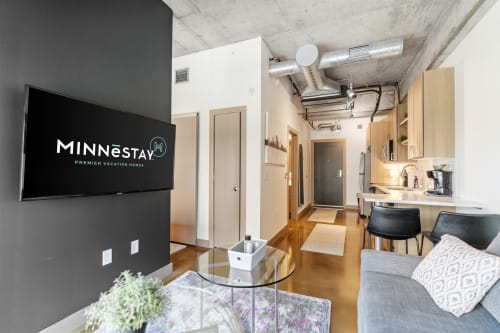A modern apartment interior featuring a stylish living area and kitchen.