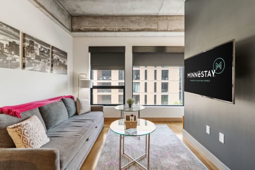 A contemporary living room showcasing elegant decor and a city view.