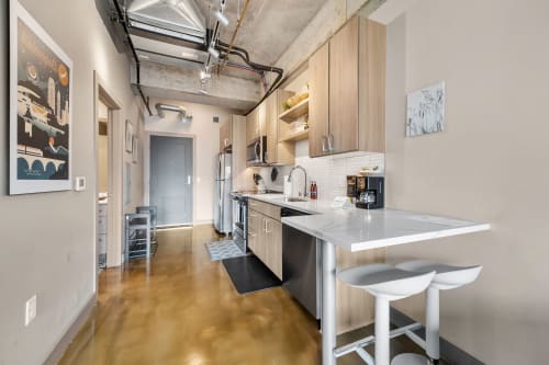 Stylish urban kitchen with modern appliances and minimalist decor.