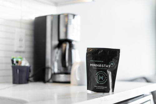 A stylish coffee setup featuring MINNESTAY coffee in a modern kitchen.