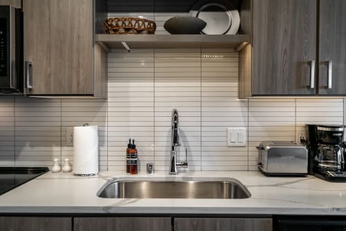 Contemporary kitchen countertop with sleek fixtures and minimalist design.
