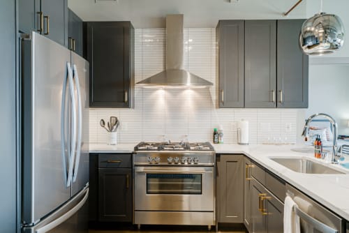 A modern kitchen featuring sleek design and stainless steel appliances.